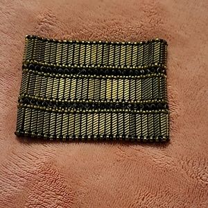 Black, bronze/gold colored bracelet